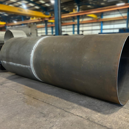 plate rolling big brown cylinders on the floor 