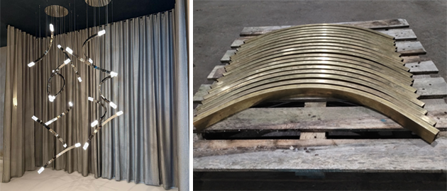 A close-up of elegantly curved brass lighting components, precision-bent by Barnshaws for CTO Lighting. 